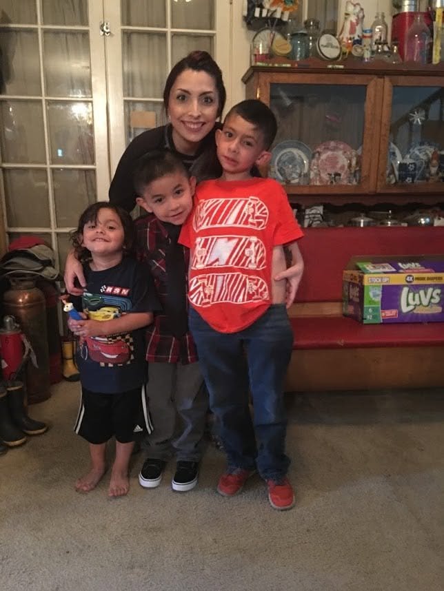 Jennifer with her three nephews Ethan, Eli and Evan.